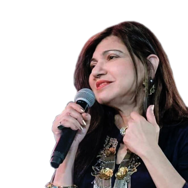 Alka Yagnik singing into a mic