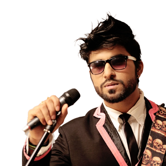 Aman Trikha, holding a mic and wearing sunglasses with a stylish outfit featuring skull design