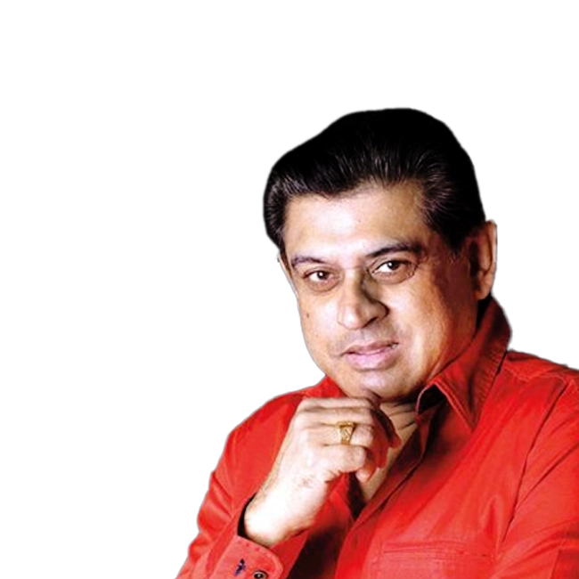 Amit Kumar wearing a red shirt with a thoughtful expression.