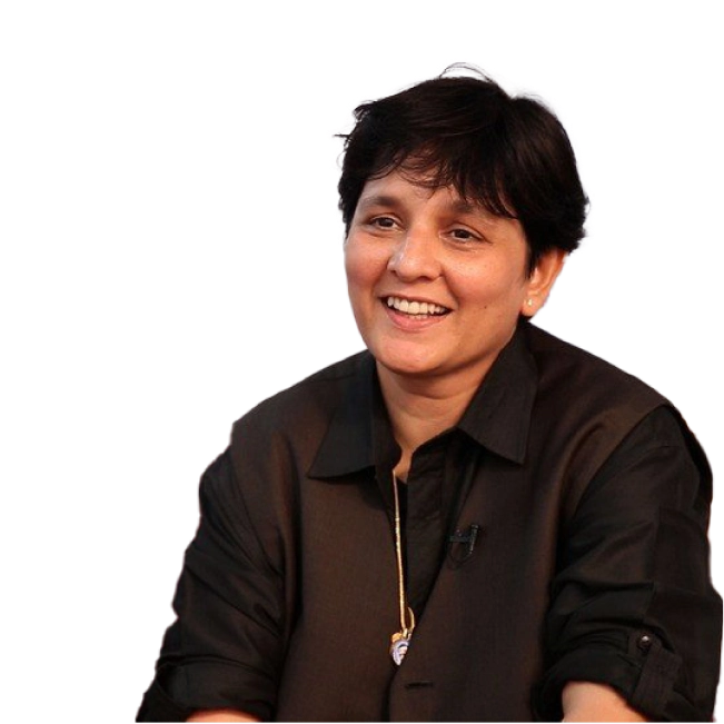 Falguni Pathak, wearing a dark shirt and smiling