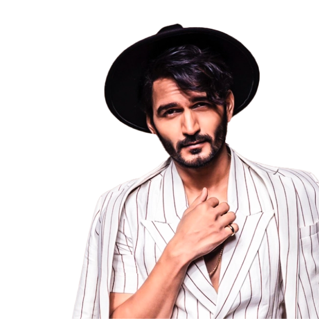 Gajendra Verma wearing a hat and striped suit