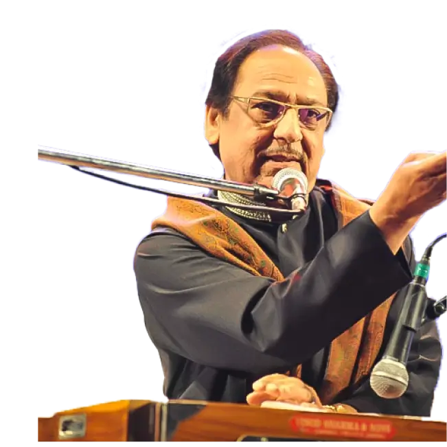 Ghulam Ali wearing traditional attire, singing while playing a harmonium