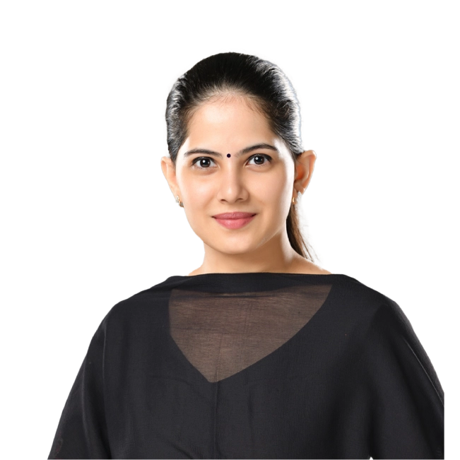 Jaya Kishori dressed in traditional black attire, smiling with a simple bindi on her forehead.