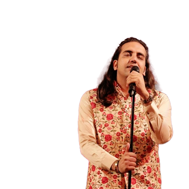 Ankit Batra singing into a microphone, wearing a floral vest and beige shirt.