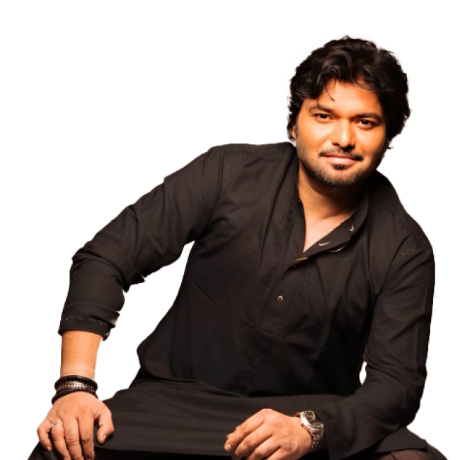Babul Supriyo, a singer, dressed in a black kurta, sitting in a relaxed pose