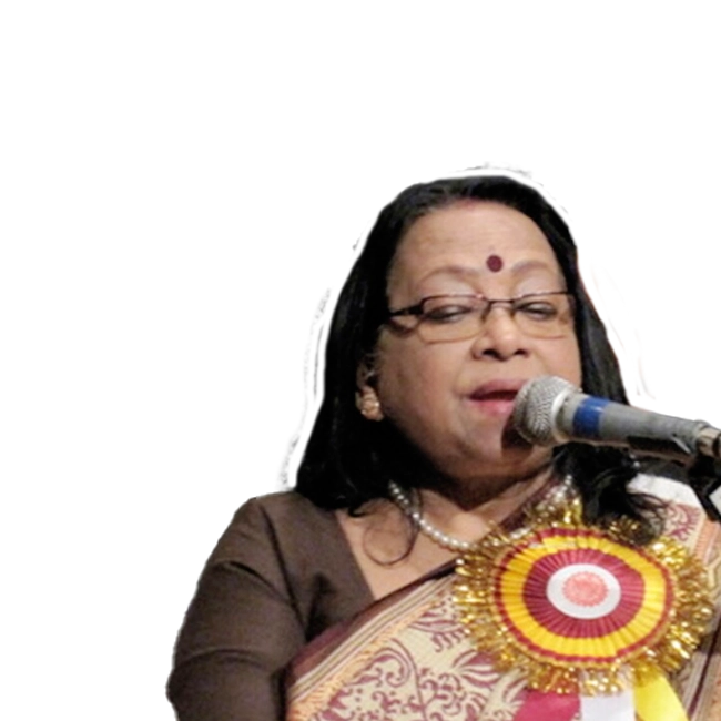 Banashree Sengupta wearing a traditional attire singing into a microphone