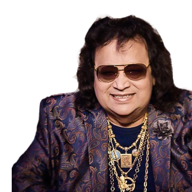 Bappi Lahiri smiling, wearing aviator sunglasses, a paisley-patterned jacket, and numerous gold necklaces
